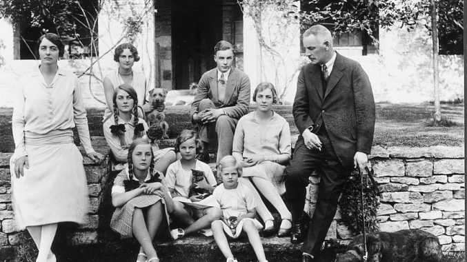 The six Mitford sisters, along with their brother and parents, in 1928.